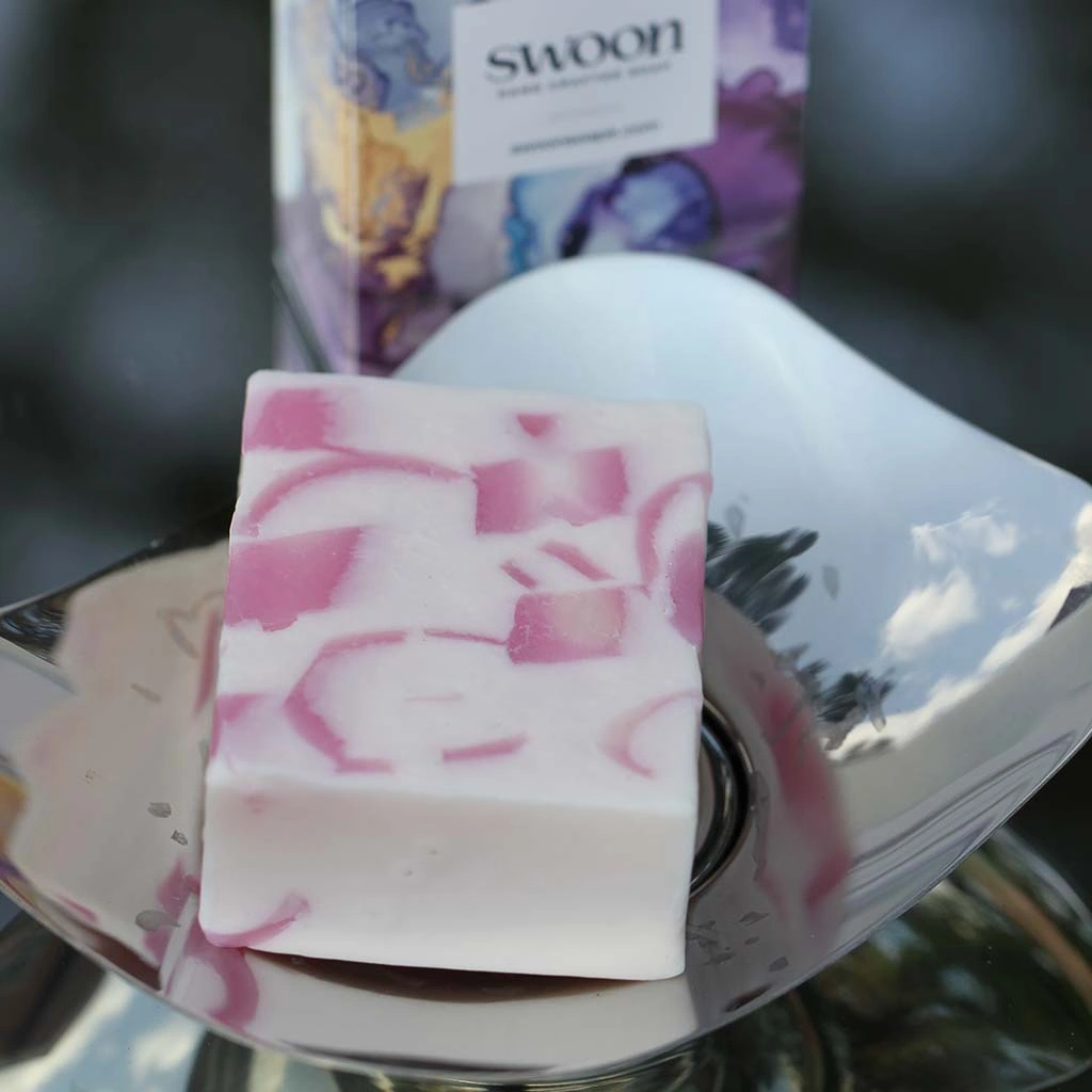 Pale pink/white oblong soap with translucent soft pink swirls. Minimum weight 95g