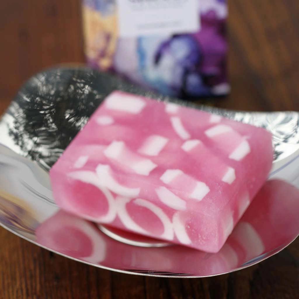 Translucent sparkling fresh pink oblong soap bar with white swirls. Minimum weight 95g.