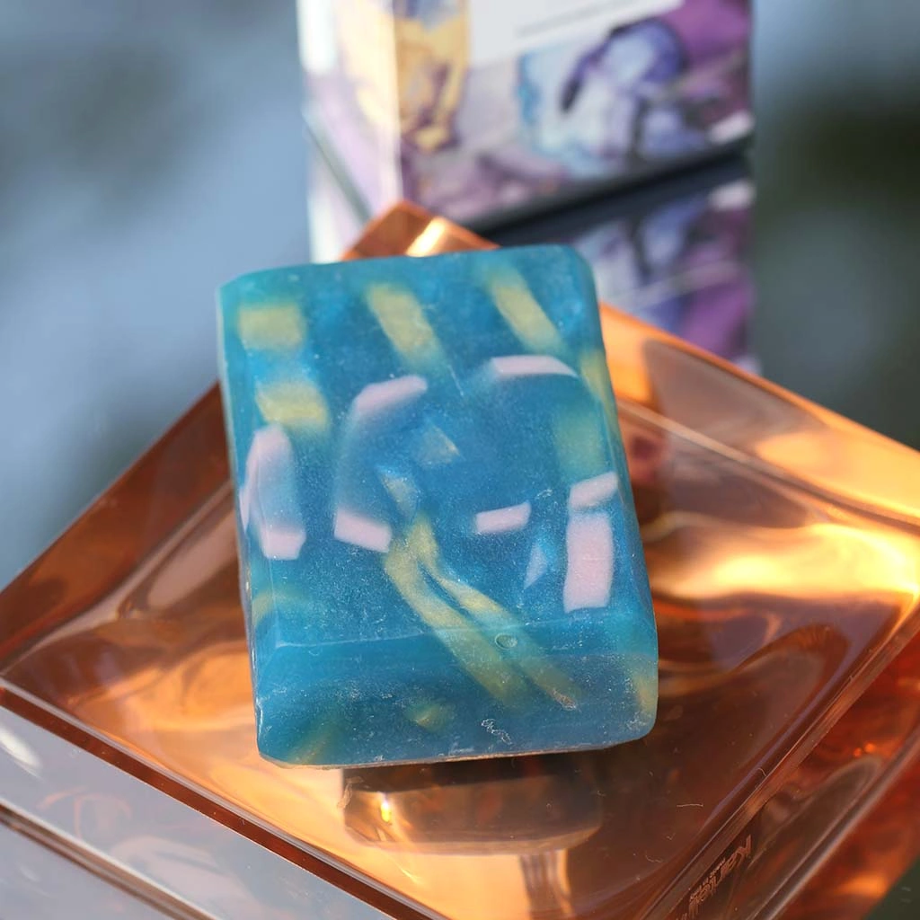 Noir Jazz Swoon Soap. Oblong soap in a sparkly midnight blue with accents of pink and yellow. Minimum weight 95g